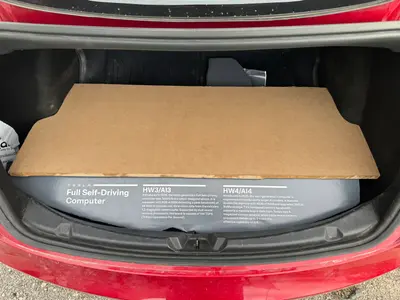 The slanted front piece wrapped in printed paper adhesive, fiberboard still bare