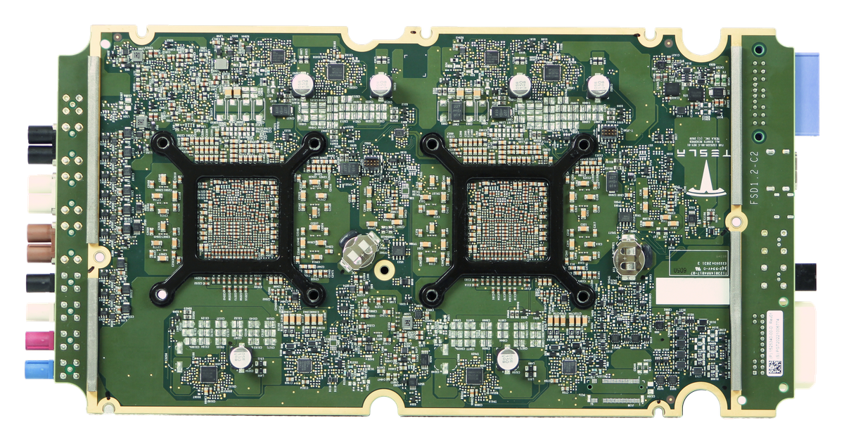 Back of the Tesla HW3 FSD circuit board with two black processor mounting frames and support circuitry.